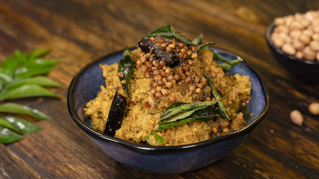 Quick & Easy Indian Recipes You Can Whip Up Anytime 13 A bowl of tomato peanut chutney with tempering poured on top