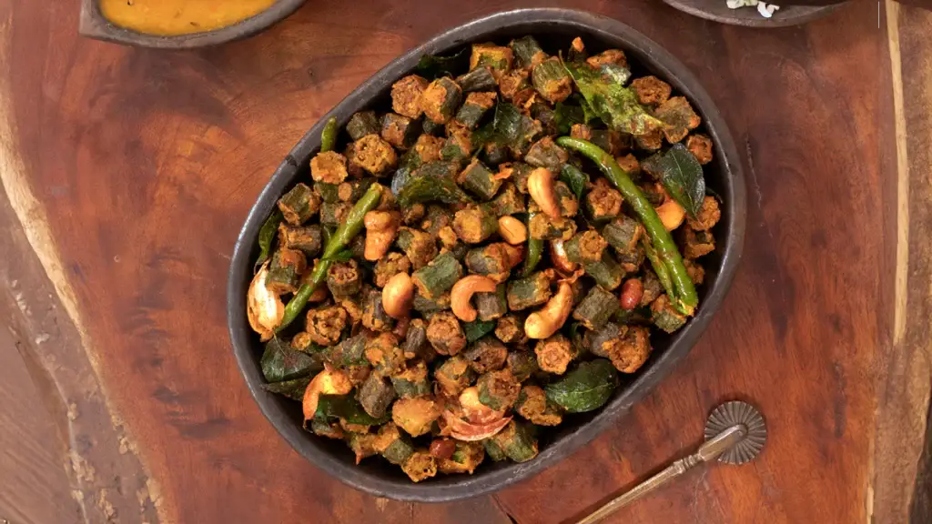 New Year Party Menu Ideas for a Perfect Celebration 24 A plate of crispy bhindi fry, garnished and ready to eat.