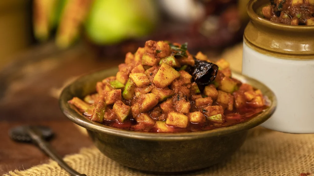Celebrating Mango Season: The King of Fruits and Its Irresistible Dishes 7 Mango pickle resting to absorb flavors