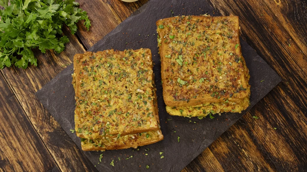 Lazy Mornings, Hearty Bites: Brunch Recipes to Brighten Your Day 6 Masala egg toast served on a plate with chutney
