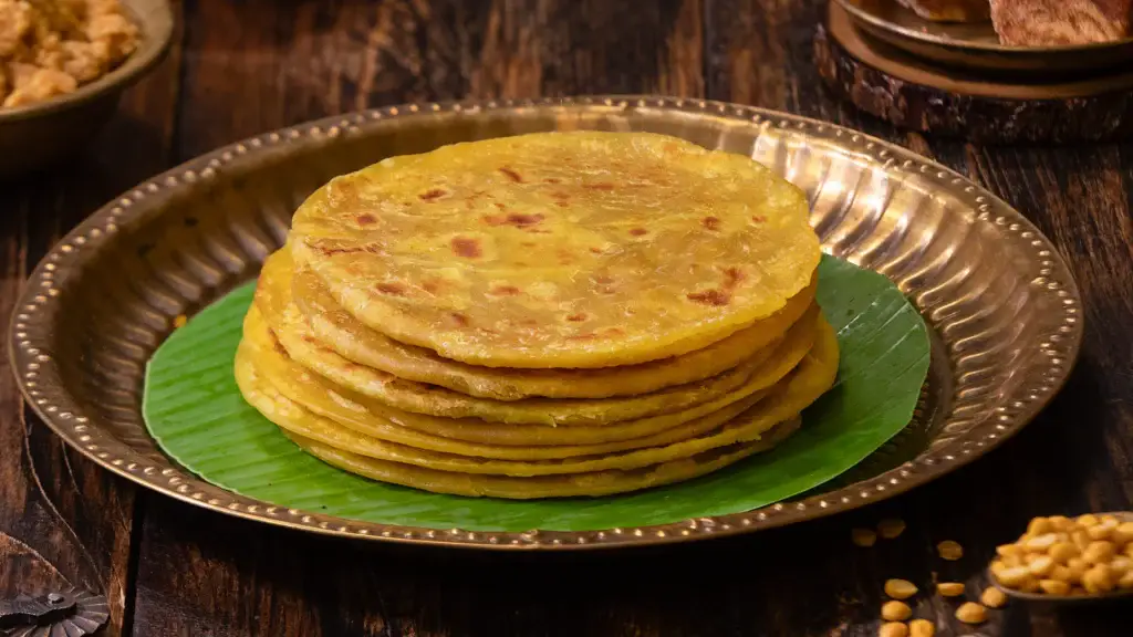 Serving puran poli on a plate with ghee