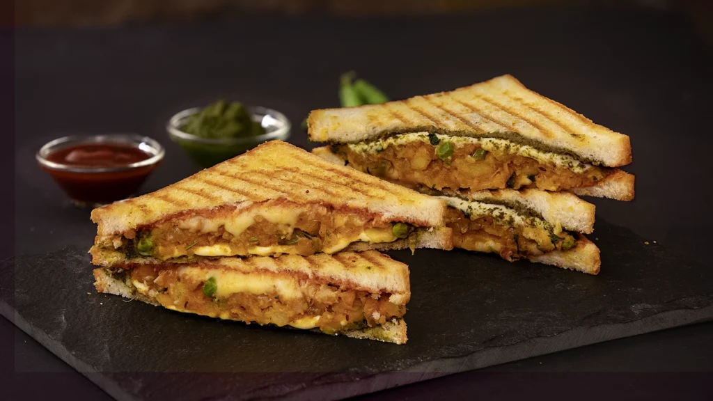 Back-to-School Snack & Lunch Box Recipes: Tasty, Nutritious, and Kid-Approved 14 A hot, golden sandwich cut in half on a plate