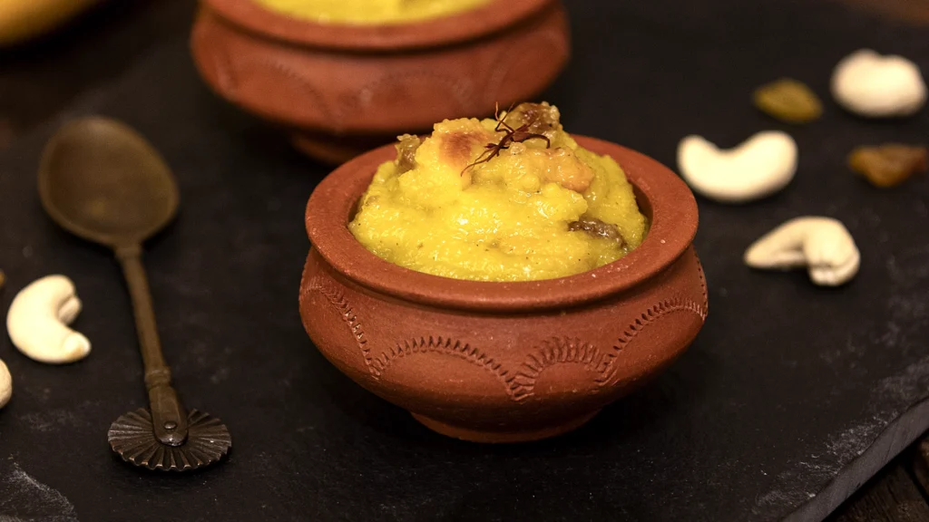 Celebrating Mango Season: The King of Fruits and Its Irresistible Dishes 3 Bowl of kesari topped with nuts and raisins