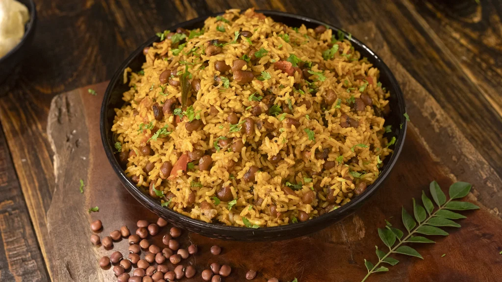 A pot of lobia rice garnished with fresh coriander