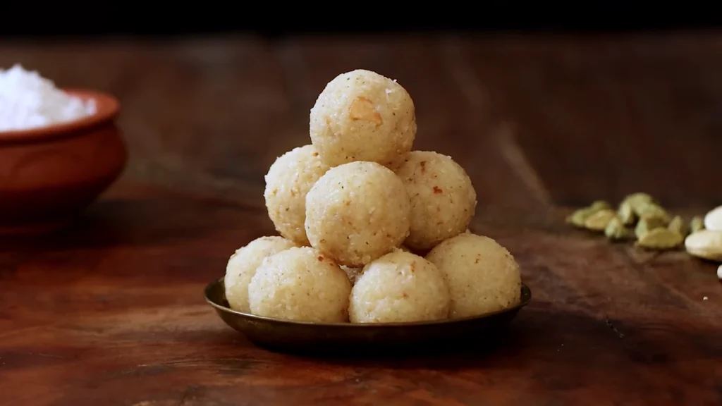 plate of finished jaggery coconut ladoos ready to eat.