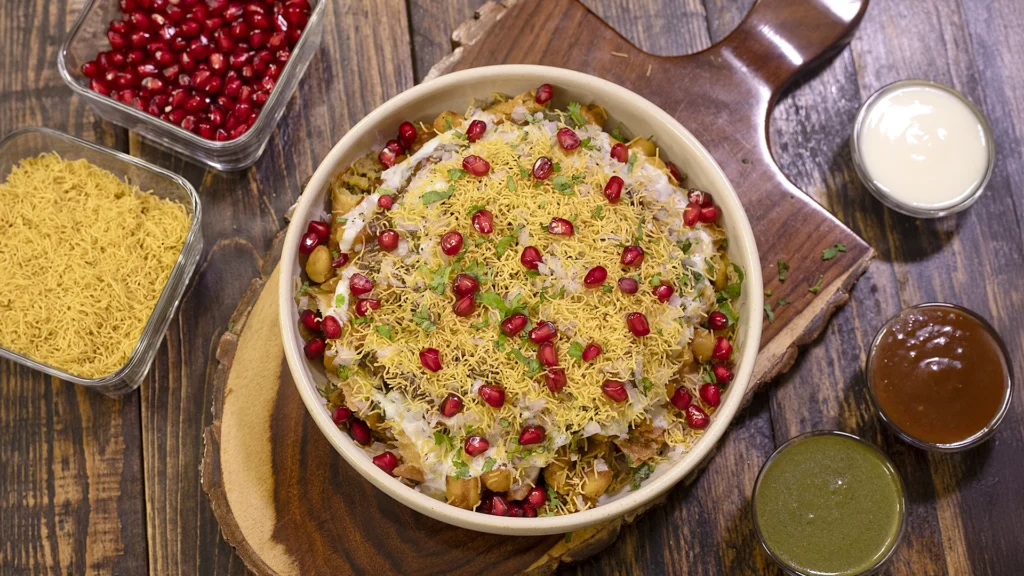 plated chana samosa chaat layered and garnished
